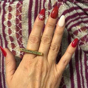 Gold statement ring with green stones